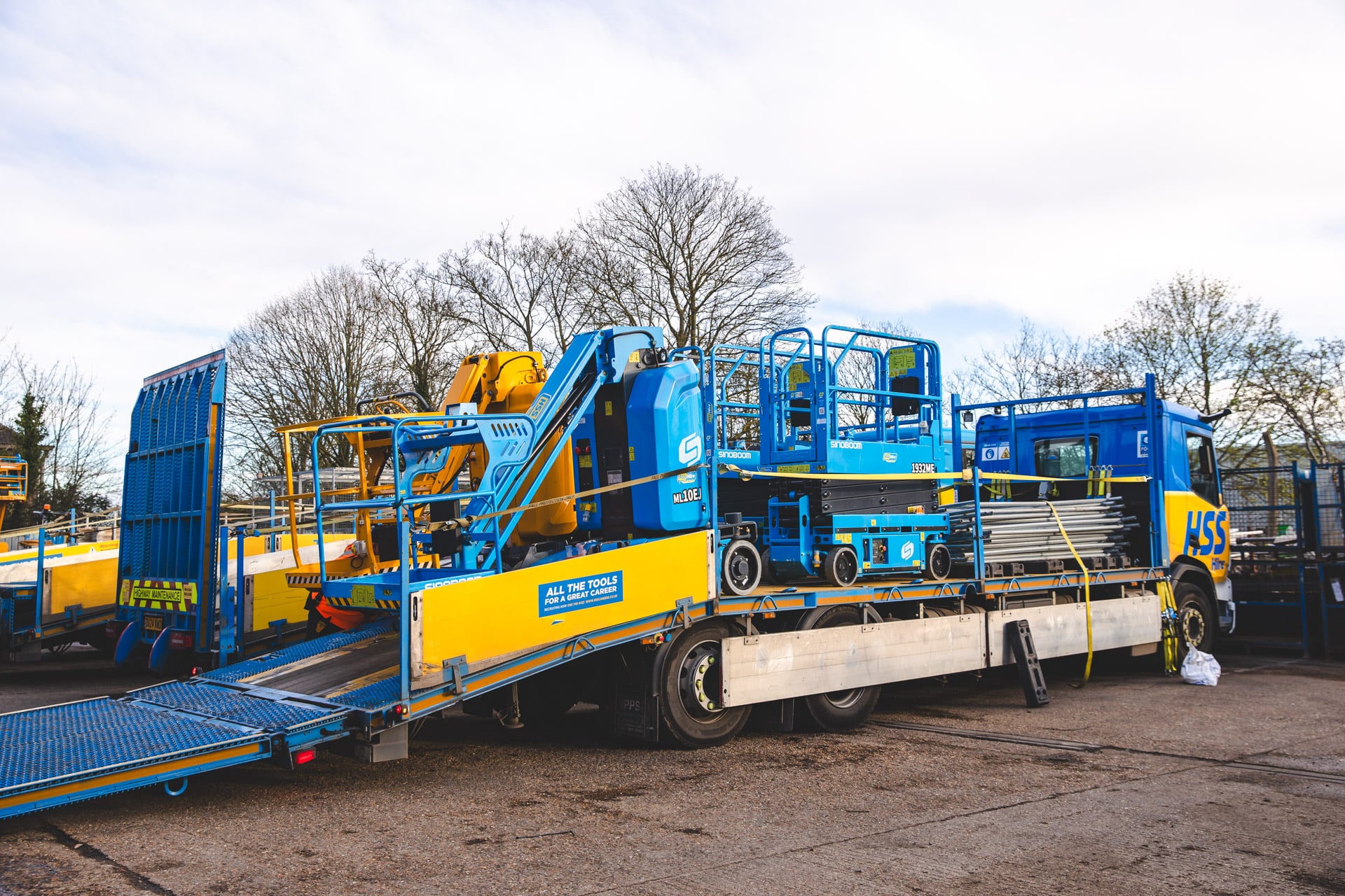 Access platforms and hire equipment being loaded onto an HSS: the Hire Service Company vehicle to support better hire spend management across construction projects.